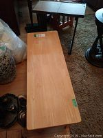 Maple wood table showing full length view to detail wood surface and wear.