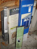 Photo of four boxes stacked: Covered Garment Rack, Garment Rack with Shelves, Clothes Closet, and Floor Shoe Rack, all in original packaging.