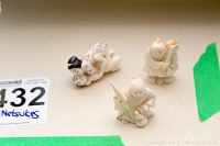 Three netsuke figurines front view