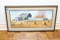 Full view of the framed watercolor showing the farmyard scene with barn and haystacks, with visible lot tag on the top left corner.