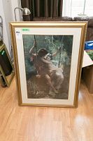 Full view of framed print showing two children on a swing and the gold ornamental frame.