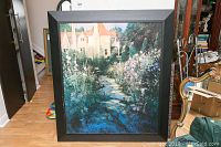 Full view of framed large garden print showing pathway, flowers, and house.
