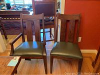 Front view of one armchair and one side chair showing seat and back detail