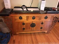 Front view of the dresser with top items shown (not included)