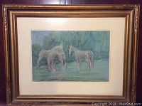 Framed pastel painting featuring three horses in a serene greenish background.