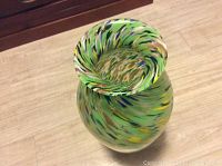 Top view showing the broad rounded mouth and swirling multicolor pattern