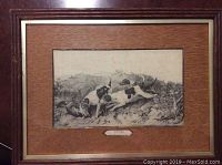 Full view of framed engraving or etching showing two dogs and a fox in outdoor hunting scene with wood matting and wood frame