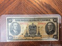 Front view of 1935 Canadian ten dollar bill showing full note with portraits and serial numbers.