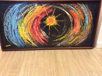 Full view of framed oil painting on floor showing entire artwork