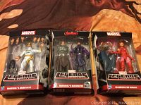 Front view of three Marvel Legends 2015 Hasbro figures in blister packaging showing Marvel's Iron Fist, Marvel's Hawkeye, and Maulers of Might figures.