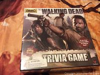 Front of new, unopened The Walking Dead Trivia Game box showing characters from the AMC TV series and game title.