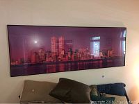 Large framed city skyline poster with purple tones (New York skyline).
