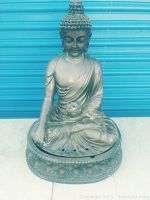 Front view of seated Buddha fountain statue made of fiberglass showing metallic finish and detailed features
