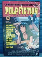 Full front view of the Pulp Fiction movie poster showing Uma Thurman, the title, credits, and festival award information.