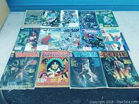 Lot of 15 assorted comic books with various covers including Spiderman, Vampirella, Eerie, and more.