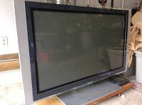 Front view of Sony WEGA flatscreen TV showing screen and frame with reflections