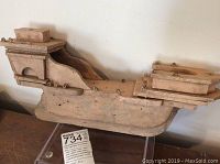 Side view of the old wooden ship model showing chippy paint and structural details