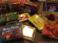 Multiple vintage Fischerform toys in original packaging, showing different brands and puzzle types, all unopened