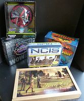 Full lot of 5 games including Box of Golf, Electronic Battleship, NCIS The Game, Cranium, and Sharper Image Maze Globe.