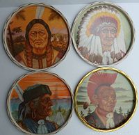 Top view of all four metal trays with Native American themed portraits and scalloped edges showing vibrant and detailed illustrations.