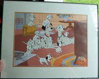 Framed lithograph showing multiple Dalmatians watching TV indoors.