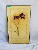 Photo of single framed floral wall art with beige decorative background and purple flower illustration