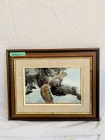 Frontal image showing the framed art print of a squirrel on snow-covered tree branch, with wood frame and beige mat.