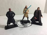 Photo showing all three Kenner Star Wars Prequel Trilogy action figures with their black display stands.