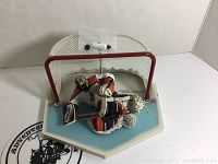 Brian Boucher McFarlane Series 2 goalie figure posed in front of goal net with puck and water bottle on net