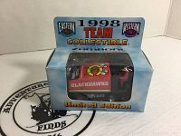 Photo showing front of the unopened box with the diecast Chicago Blackhawks Zamboni visible inside.