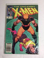 Photo of the comic book The Uncanny X-Men issue 177 showing front cover with two characters on a green background, priced at 75 cents, published by Marvel Comics.