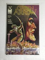 Front cover of Green Arrow #1 comic book by DC Comics showing character aiming an arrow over a city at night.