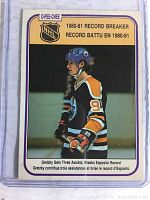 Front side of the 1981 OPC Wayne Gretzky hockey card showing him in Edmonton Oilers uniform with details of the record achievement for the 1980-81 NHL season.