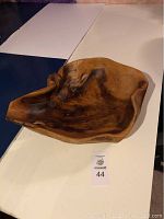 Photo showing the full view of the large wooden bowl with natural grain patterns and smooth finish