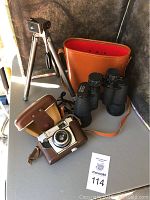 Full lot showing Zenith camera in leather case, Zenith binoculars with leather case, and metal tripod stand.