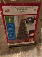 Label on the original box showing product details including height, number of lights, and branch tips.