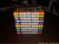 Stack of 9 Diary of a Wimpy Kid books showing the spines with title and author.