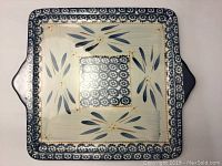 Top-down view of the square platter showing floral pattern and handles