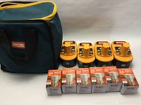 Green Ryobi tool bag with black carrying handles and yellow zipper, Ryobi logo on front