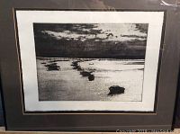Framed black-and-white etching of sailboats on water at sunset or sunrise with reflective water surface.