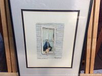 Full view of the framed watercolour painting of a cat in a window, matted and under glass.