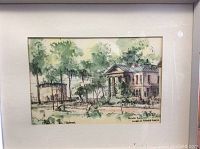 Framed watercolor painting showing historic buildings and trees, labeled by artist Fred Schonberger depicting Kingston at Barrie and King Street.