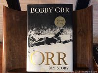 Front cover of the Boby Orr book showing the title and a 'Signed Copy' sticker.