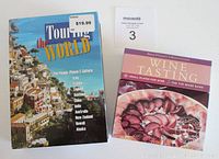 Photo of Travel the World DVD set box and Wine Tasting Recipes CD and booklet side by side.