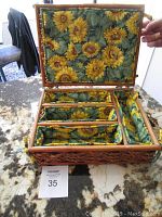 Opened view showing sunflower fabric lining and divided compartments inside basket