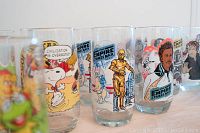 Close up showing Star Wars Empire Strikes Back glasses with colorful character illustrations