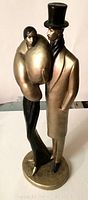Full view of the 1986 Austin Prod Inc Le Clere plaster sculpture with two figures
