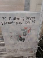 Close-up of the included instruction and information sheet showing '79' Gullwing Dryer' branding and features.