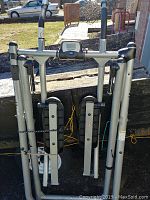 Folded Tony Little's Gazelle cross trainer showing its compact form with digital display and foam handles.