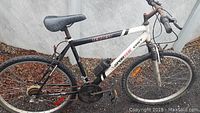Side view of the Sportek Tempest adult mountain bike showing frame, tires, saddle, and pedals.